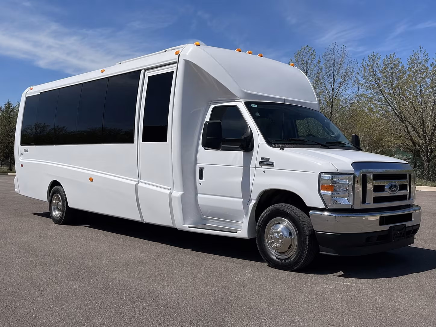 Group beside a Mercedes Sprinter limo in Pueblo